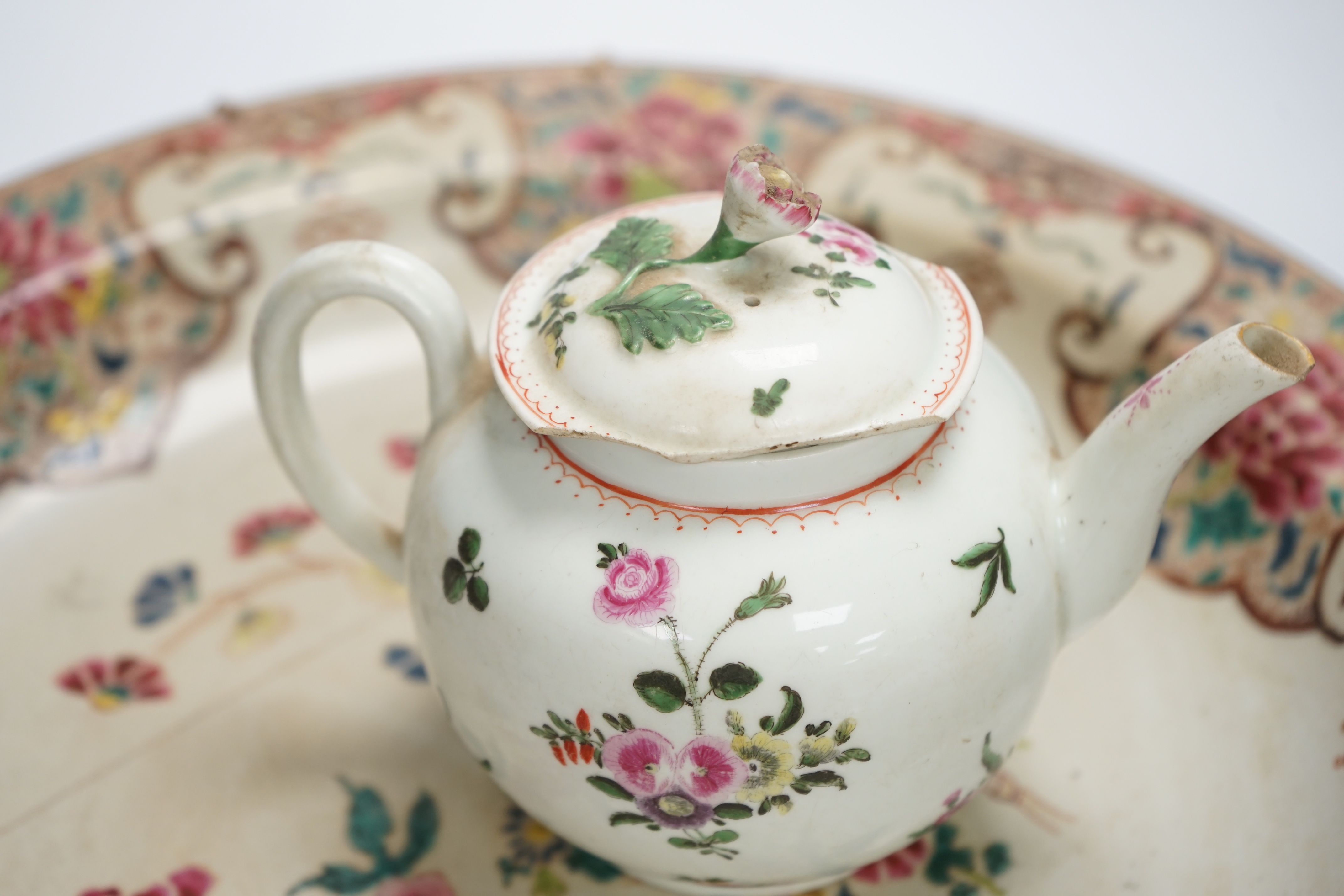 A Worcester teapot, c.1770, two 18th century Chinese porcelain dishes, a cup and saucer, a Chinese shallow bowl and a small teapot, largest dish 39cm